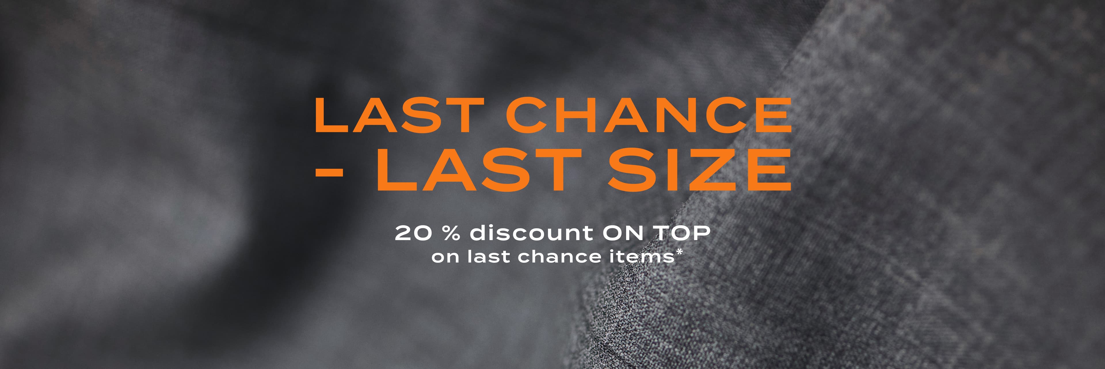 Banner with the text ‘Last Chance – Last Size’ and a note about 20% additional discount on reduced last-chance items against a grey fabric background.